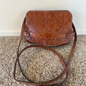 Patricia Nash Clutch with snap closure and crossbody strap.  Vintage style